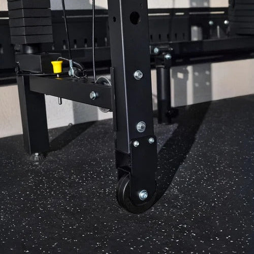 Black metal weightlifting rack on a black floor with a blurred background