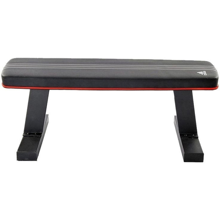 Black and red weight bench with Adidas logo on a white background