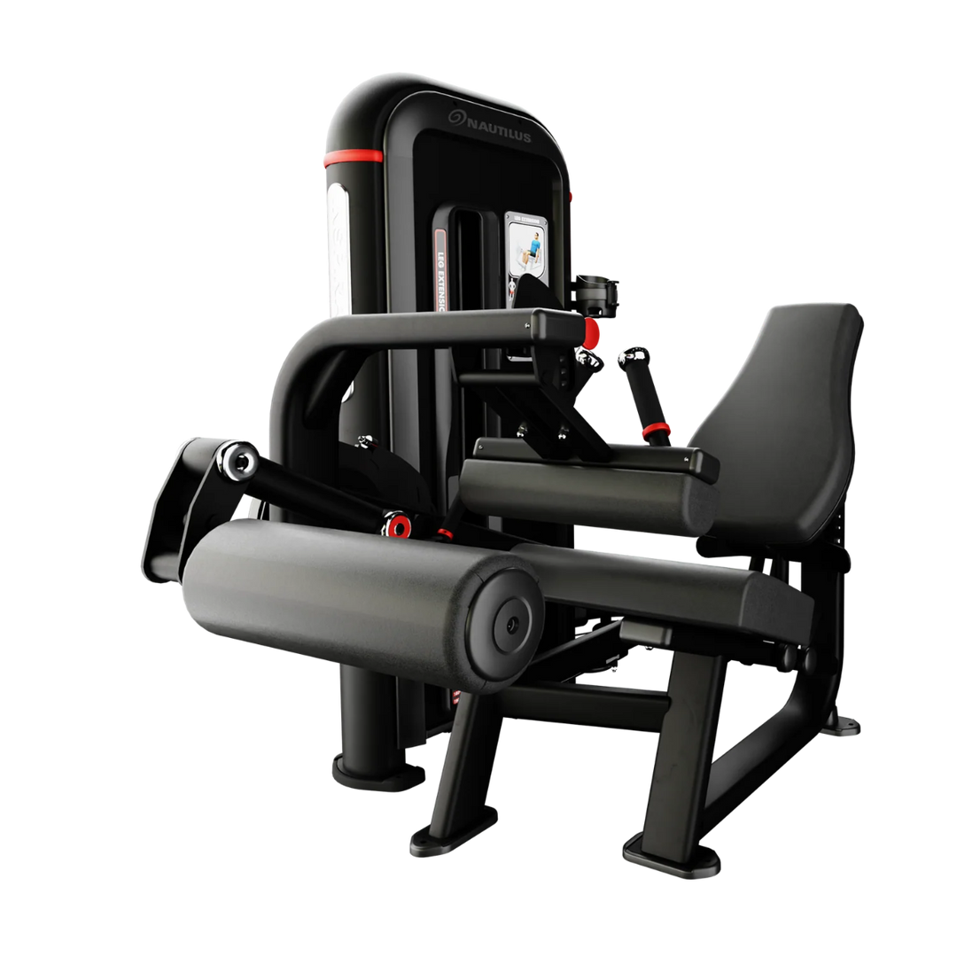 A black and gray leg extension gym machine with red accents, shown from a three-quarter angle on a solid white background.