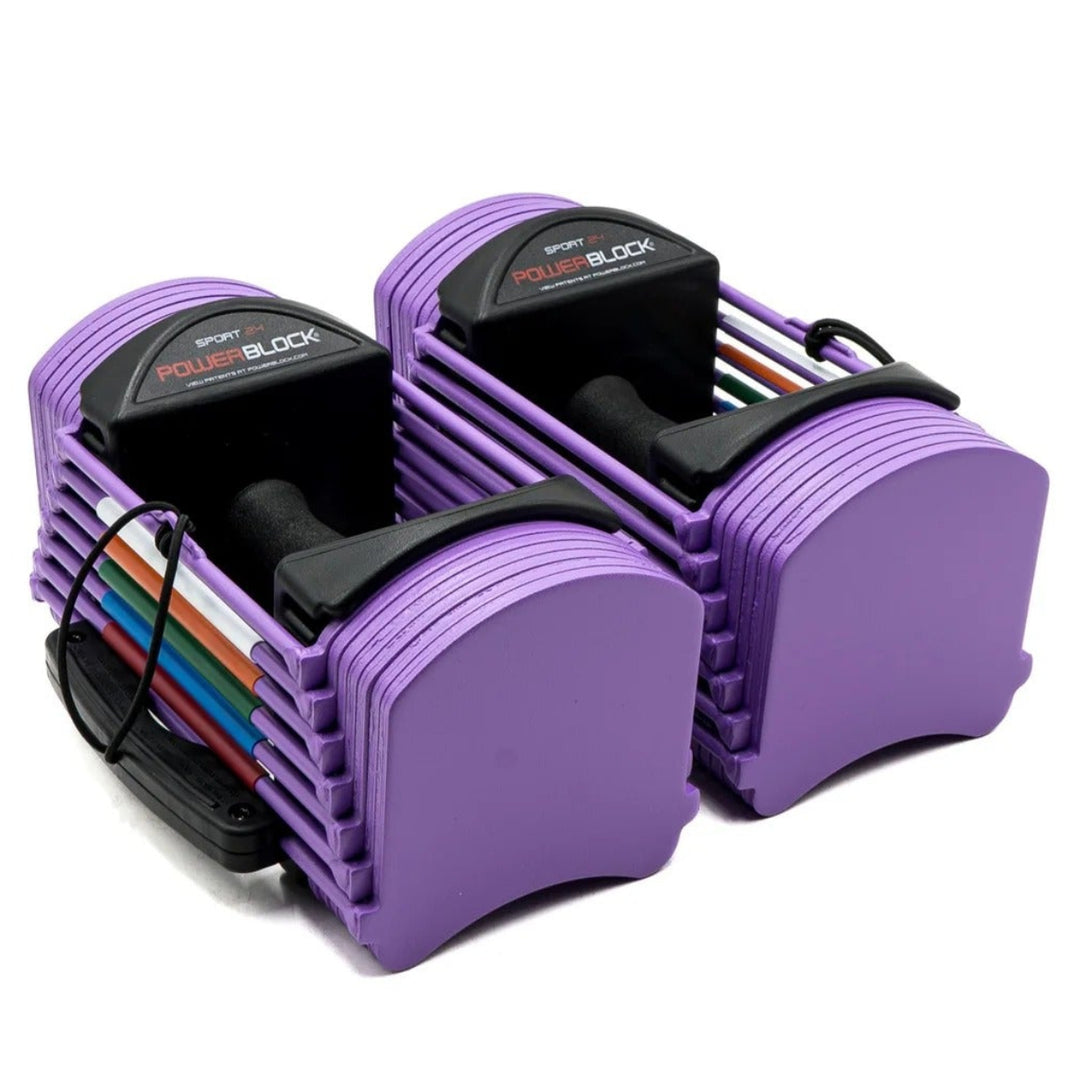 Purple dumbbell set with weight plates on a white background