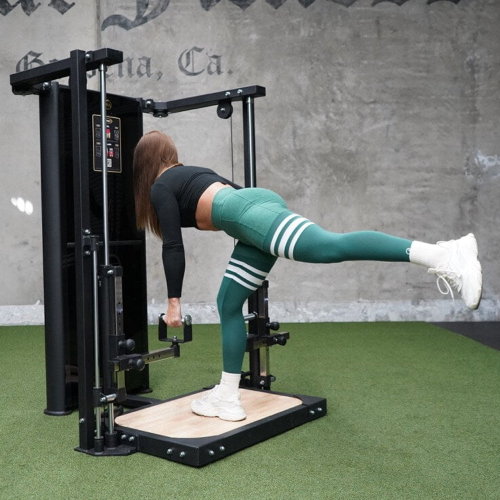 Person exercising on a piece of exercise equipment in a gym setting with &