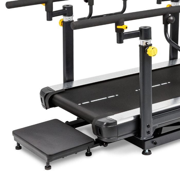 A black and silver treadmill with an attached step platform and yellow adjustment knobs, shown on a clean white background.