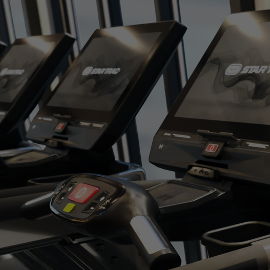 Star Trac exercise machine with a screen displaying branding