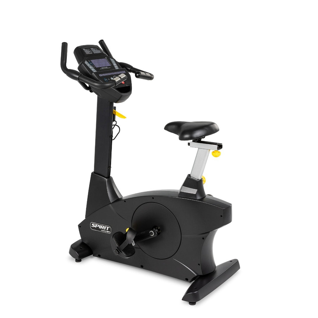 Black exercise bike with digital display on a white background