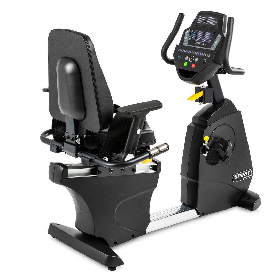 Recumbent exercise bike with digital display on a white background