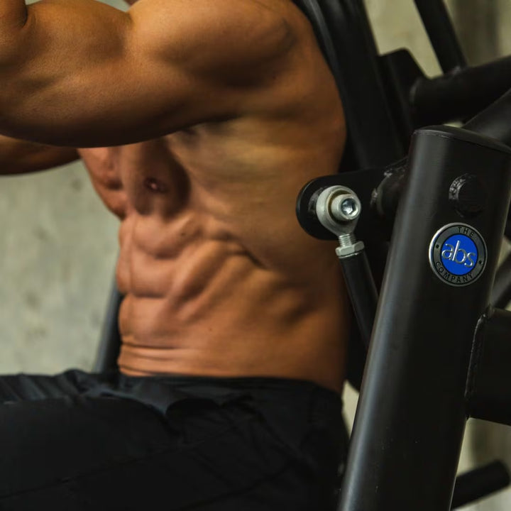 Person exercising on a piece of fitness equipment with a visible brand logo.