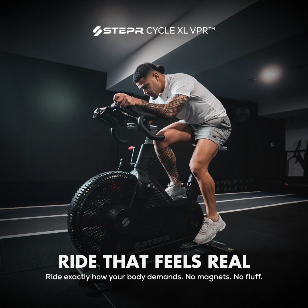 Person using a stationary bike with 'Stepr Cycle XL VPR' branding and text about realistic riding experience.