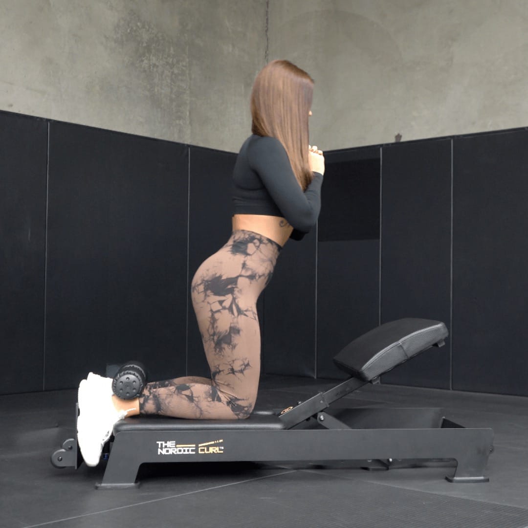 Woman using a rowing machine in a gym setting