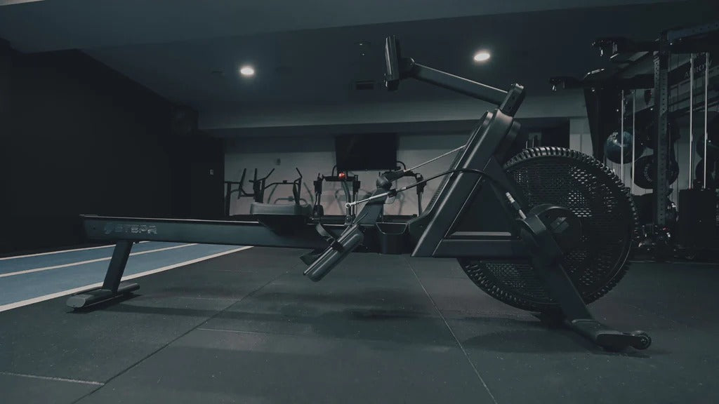 Indoor cycling roer in a dark indoor gym