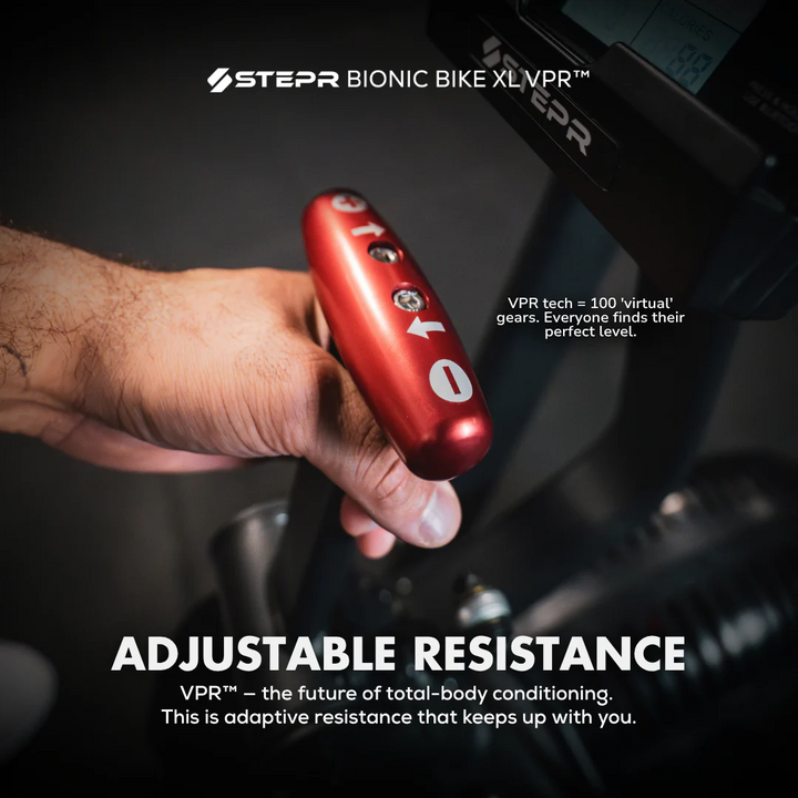 Hand holding a red adjustable resistance device with STEPR branding on a dark background