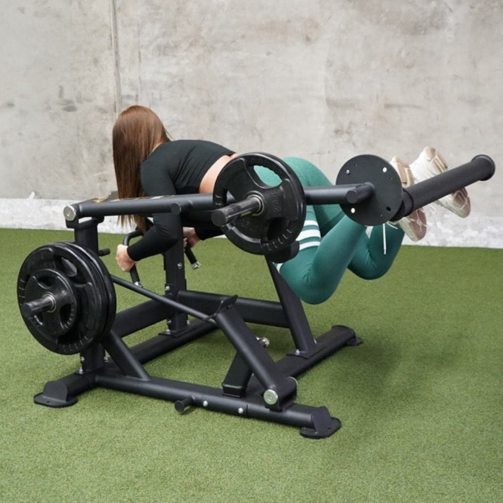 Person using a weight machine in a gym setting