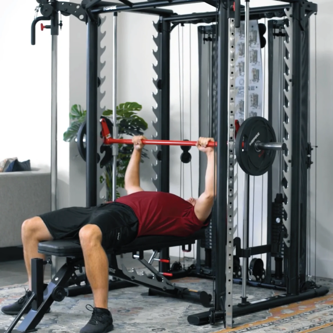 Person using a weight bench in a home gym setting