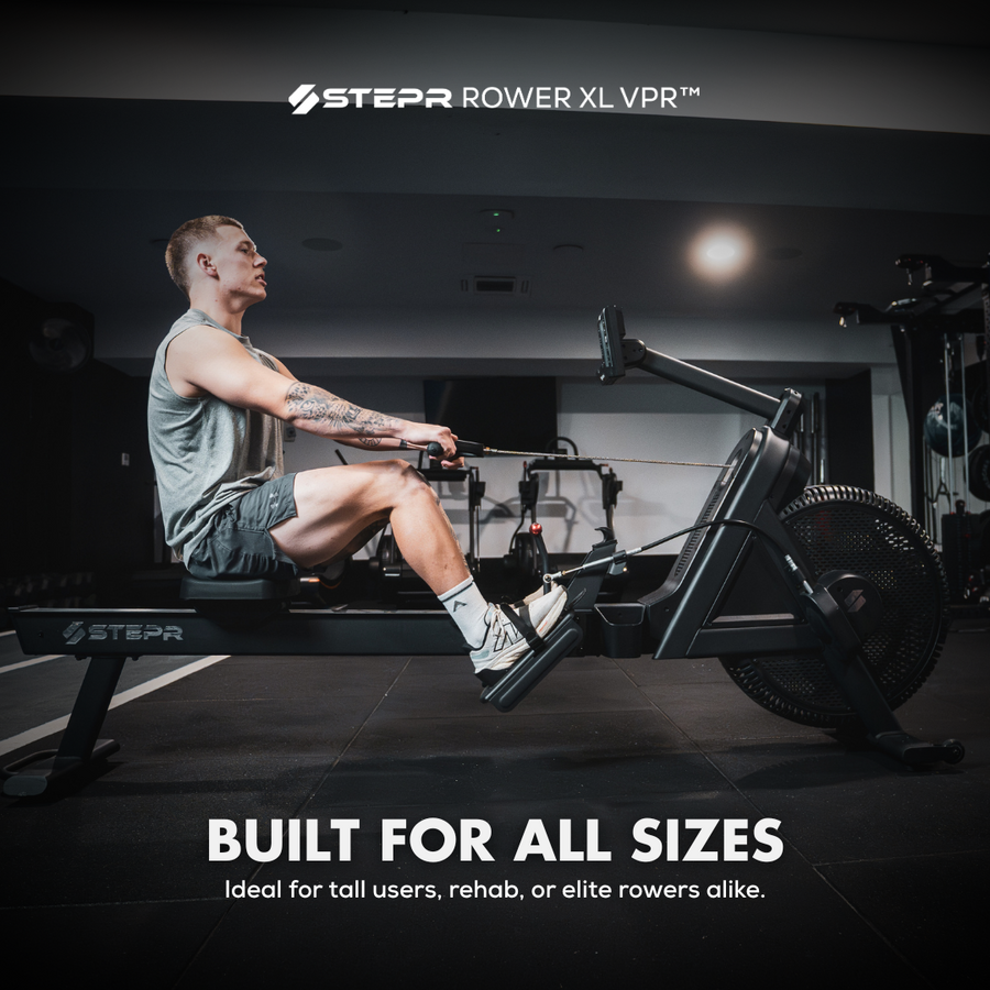 Person using a STEPP ROWER XL VPR rowing machine in a gym setting.