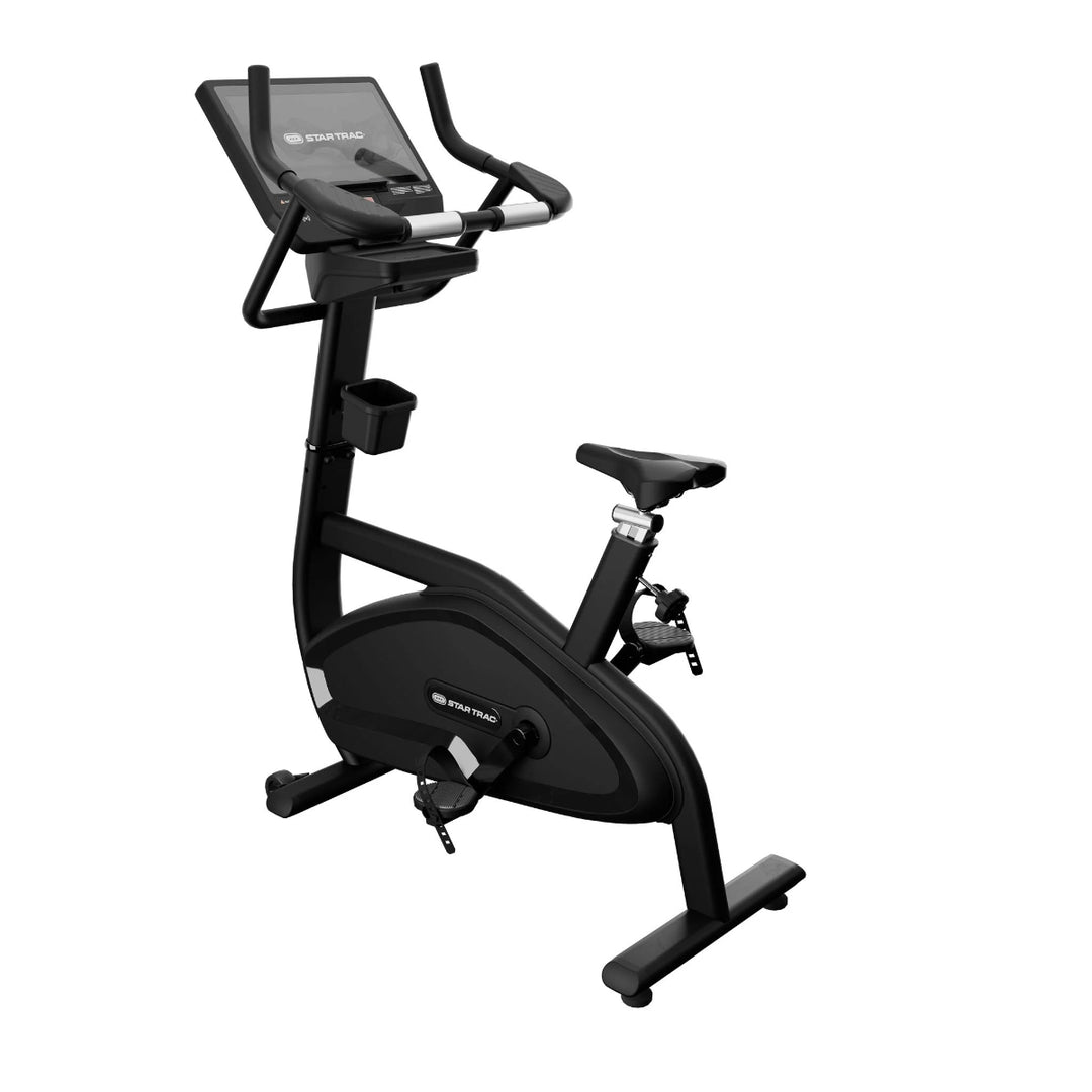 Black exercise bike with digital display on a white background