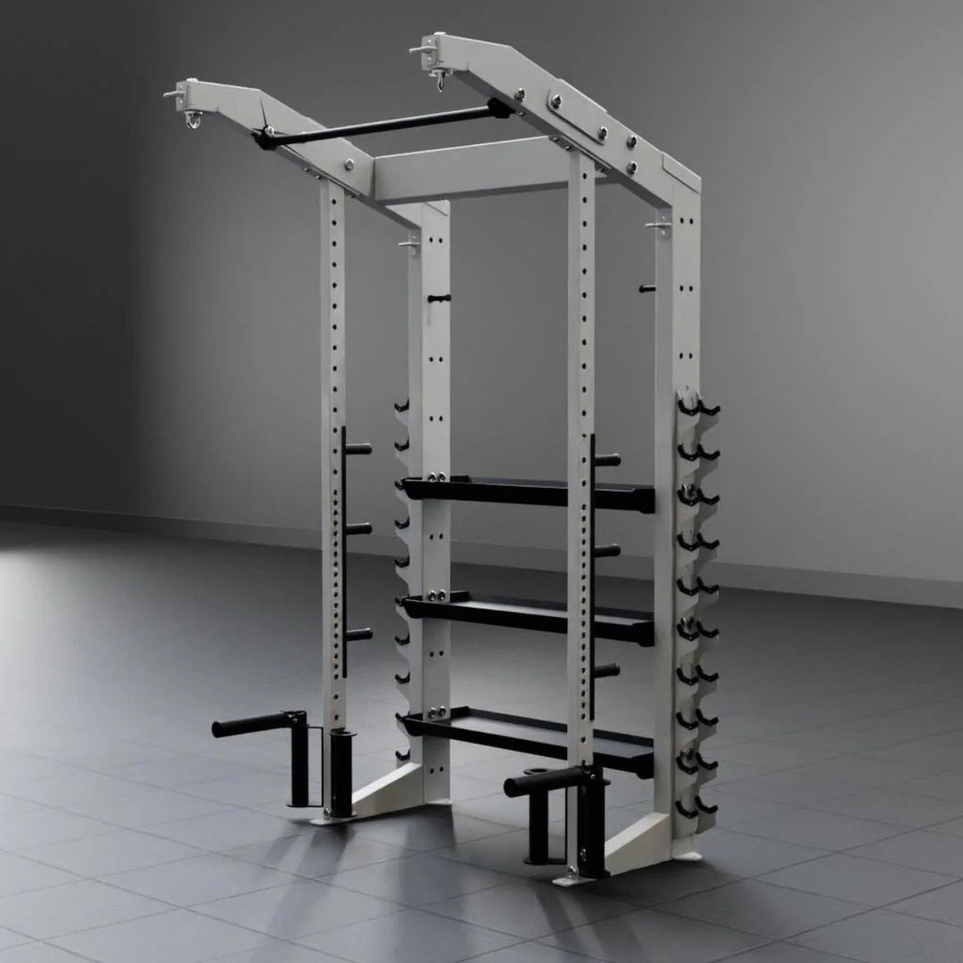 Gym power rack in a dimly lit room with a gray floor and wall.