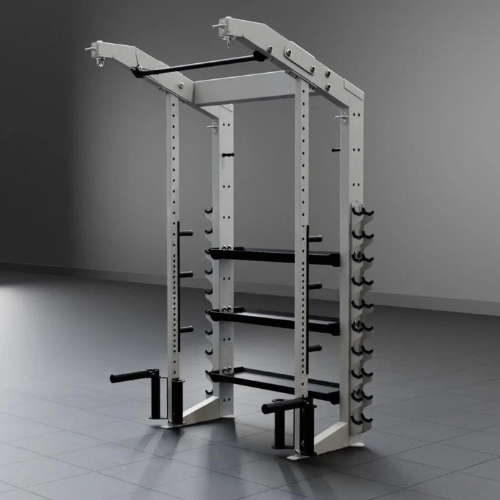 Gym power rack in a dimly lit room with a gray floor and wall.