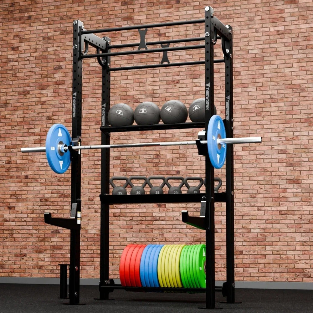 Weightlifting rack with weights against a brick wall