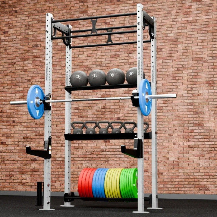 Gym rack with weights against a brick wall