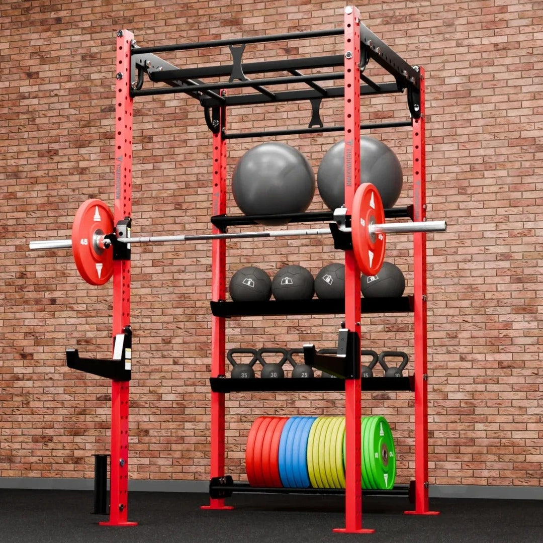 Red weightlifting rack with weights against a brick wall
