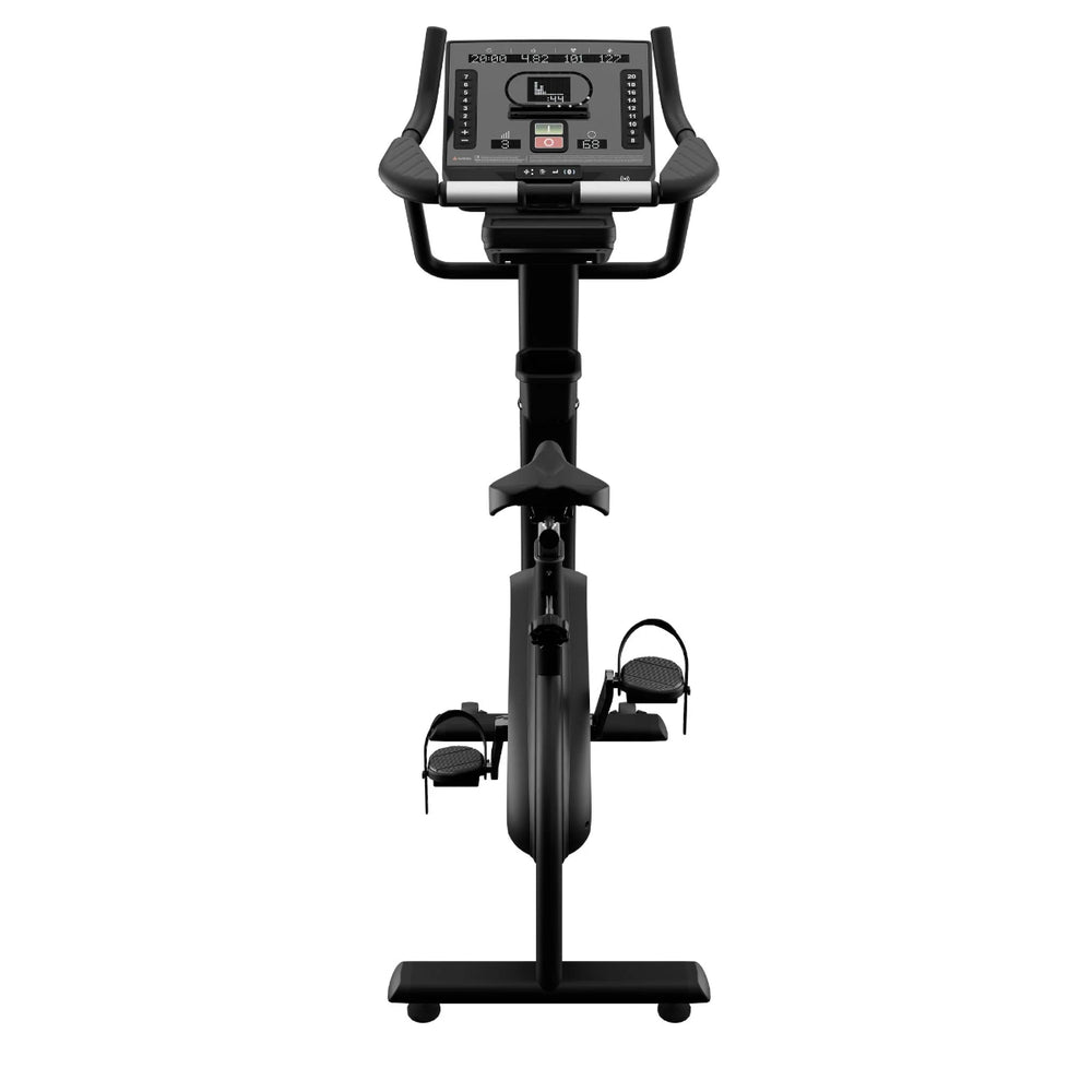 Black exercise bike with digital display on a white background