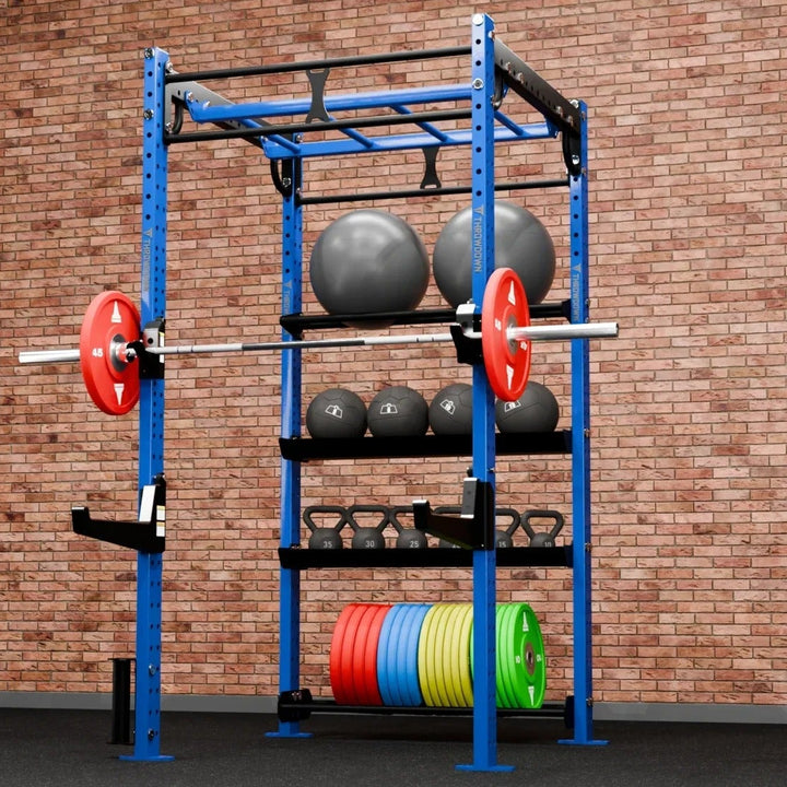 Gym rack with weights against a brick wall
