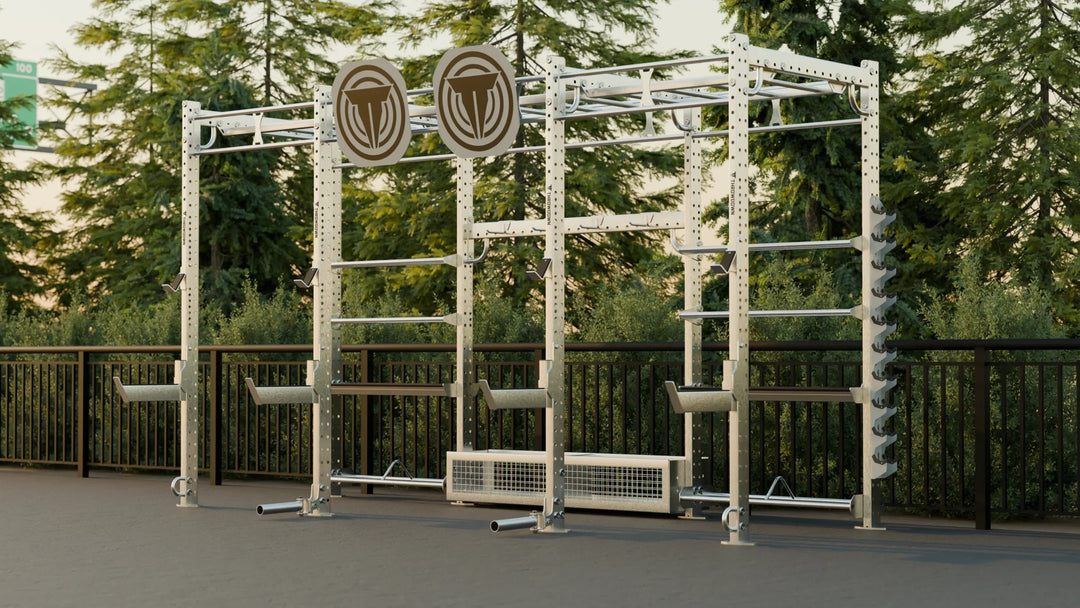 Outdoor fitness equipment with visible brand logos in a park setting