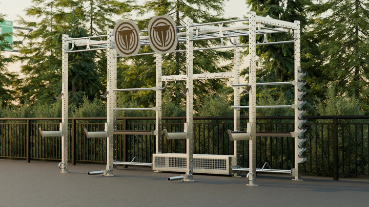 Outdoor fitness equipment with visible brand logos in a park setting