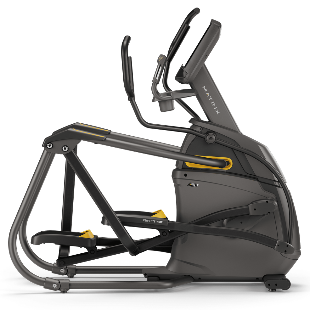 Matrix commercial-grade elliptical cross trainer in dark gray and black with yellow accents, shown from a side profile view on a white background.