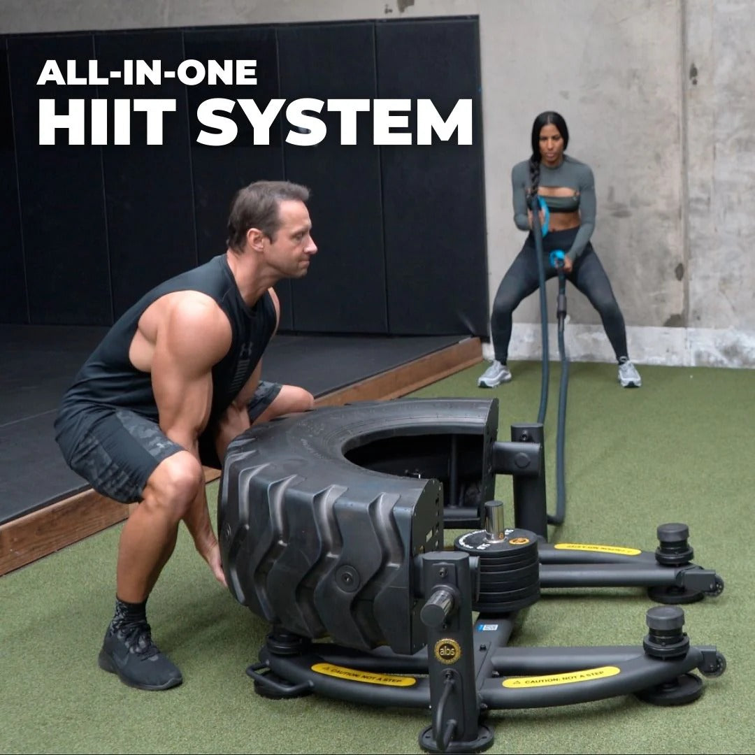 Two people using an All-in-One HIIT system in a gym setting.
