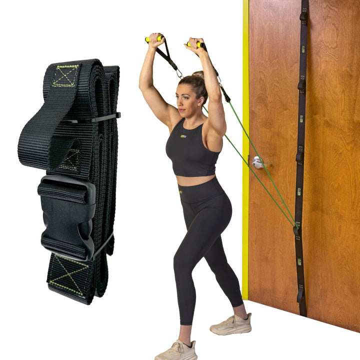 Woman using a black resistance band trainer against a wooden door